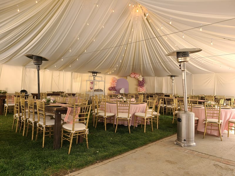 Elegant wedding tent reception with tables