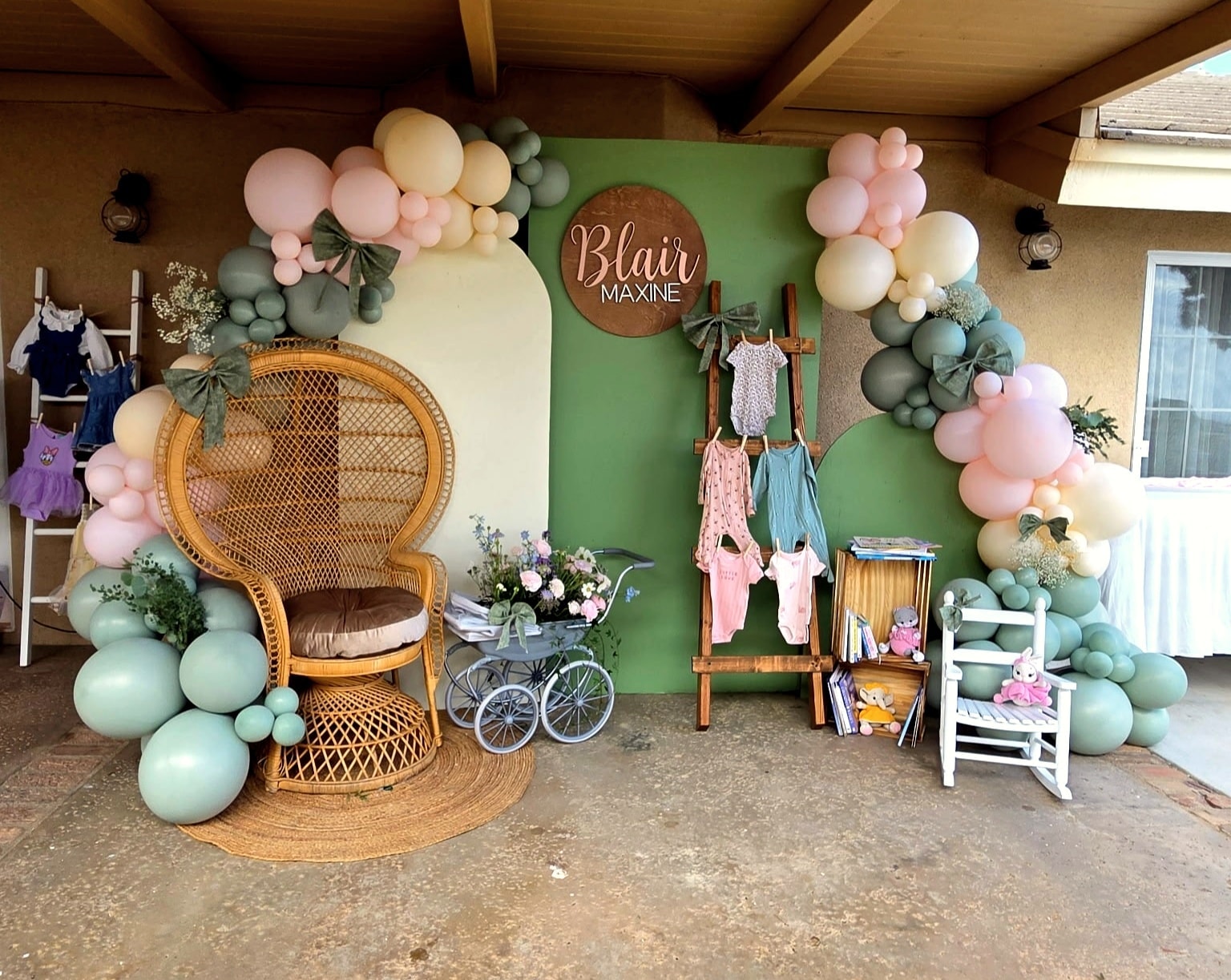 Neon Better Together sign with balloon garland backdrop